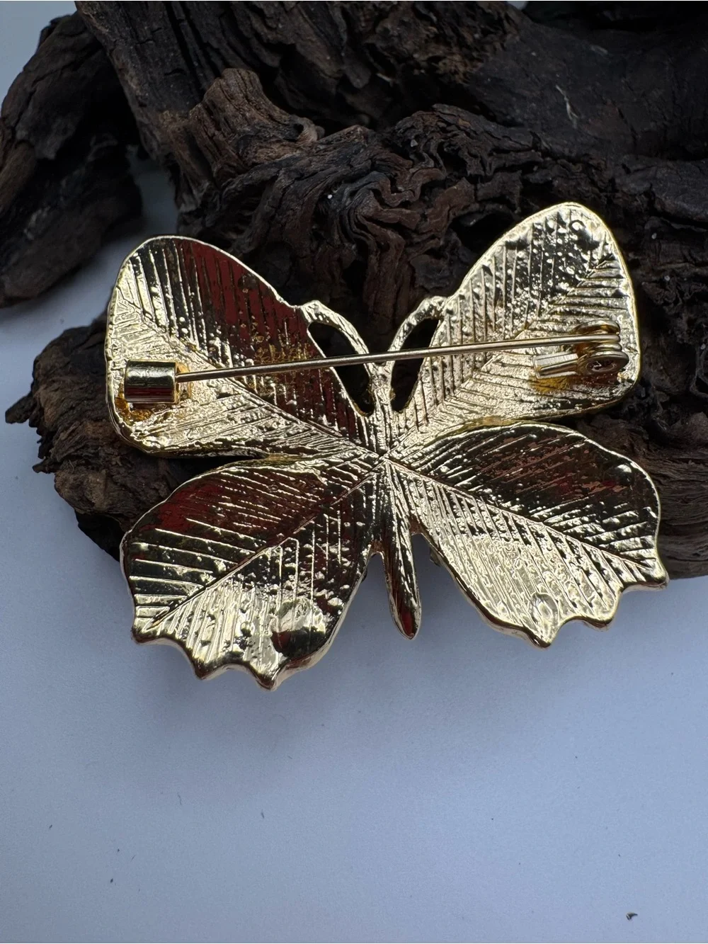 Butterfly brooch, EUC. Modern, gold-tone with multicolored rhinestones.